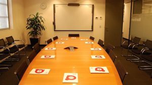 Screenrights board room, table and chairs, whiteboard and plants