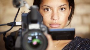 Woman holding video camera
