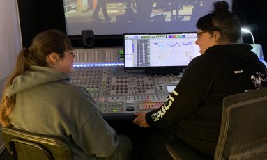 Students in mixing room Students in mixing room